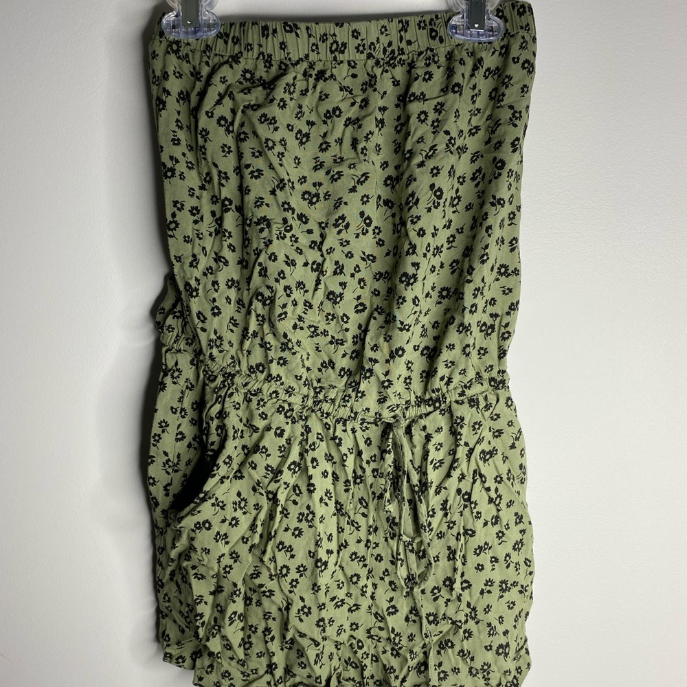 Green romper with flower design